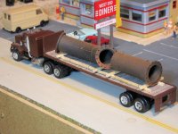 flatbed truck with pipes.jpg