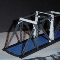The CB&Q had several TT bridges that looked very similar to this.  This is my version made from a peco base and built with Central Valley bridge girders and card stock.