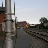 a bent signal ladder as a csx coal train rumbles through Charlottesville.