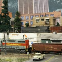 An HDLX SD35 pulls some old 70-Ton Coal Hoppers now used for hauling ballas