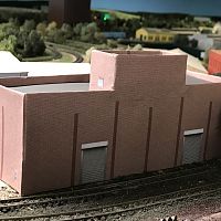 Upgraded IBS Scrap Yard Sorting Building with its new "skin" on. Still needs to have the brick covered pilasters glued on