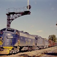 B&O #7094 leading a manifest train west through Mitchell,IN. November 1969.