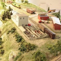 Sand Springs Railway - The stock yard and pens were all built from styrene.  The lumber loads were cut from hobby plywood and the ends painted to represent stacked lumber.