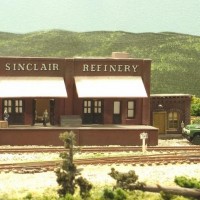 Sand Springs Railway - The Sinclair ware house, does not have interior lighting, but I used clear plastic with a light dusting of flat black, it gives the outward appearance of a tar roof but lets the lights from above show through to light the building.  This method was also used on the engine house with great results.