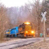 W&LE 3068 6382 6353. This colorful trio was seen at the Narrows Hill Road Crossing in Connellsville Township, PA.  They were headed northbound back to Green Tree.