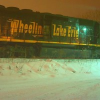 W&LE 3067 was seen idling on the end of the Wheeling and Lake Erie line in Connellsville, waiting to get onto CSX. It was joined up with W&LE 6316 and W&LE 3073. This engine is an ex-Union Pacific SD40-3 built in December 1966.  The background lighting for this was created by the lights of the Connellsville Municipal Authority (a large sewage treatment plant). Normally the light does not appear so bright at night but the deep snowcover reflects all the light back into the air. "Night Landscape" setting with about -0.7 EV was used with this. Date was 01/06/2010.