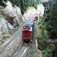 Westbound in the hole at Coykendahl.  Trees are modified Woodland Scenics and Heki.  Caboose is a Kaslo Kit, which was built and painted for me by the kit designer, Jeff Briggs of Victoria BC.