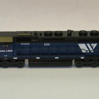 MRL 330 SD45-2.  Used Pollyscale CSX blue.  Relocated the horns, made the small electrical box behind the cab from styrene, added the 2 small vents on the roof (one under the horns and the other between the exhaust stack and front dynamic fan) and filled in the rear number boards.  Yep, the real one still has its low-mount brake cylinders.