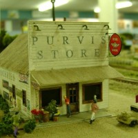 Scratchbuilt Purvis Store on the club's traveling layout. Purvis Store sign, groceries sign and gas decal on roof are homemade.