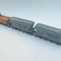 Two E&D Z-scale kits 2 bay center flow covered hoppers.