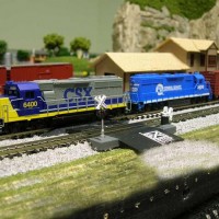 A CSX YN2 GP38 leads a Conrail GP38. I got to run some trains today and I took this pic. I got the Conrail loco a few months ago for thirty dollars and it ran ok but I upgraded it with scale speed motor and white LED's. Now it runs very nice and slow and I can run it with my CSX GP38 YN2's or my GP38 YN3's. I know most guys would CSX patch the Conrail but I wanted to leave it alone let's face it this way I can run it with another Conrail loco since I also have a Dash 8 Conrail or I can run it with my CSX locos.