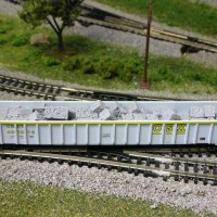 This is an Exactrail 63' thrall gondola with baled scrap metal load. I just got a pair of these and they are by far the longest gondolas that I ever had on my layout so far.