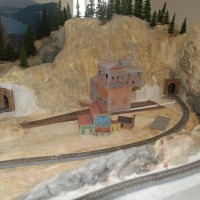 The terrain has had pigments applied, and track reinstalled. Buildings placed for reference

Panorama showing more of the terrain