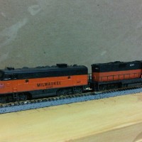 Micro-Trains Z-scale F7 and GP9, weathered with winterization hatch and amber warning beacon.