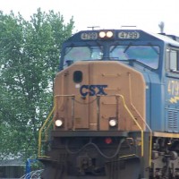 A SD70MAC leads a steel coil train through Tontogany.