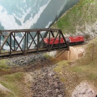 FM helper pair X8608 drifting downgrade across Slide bridge to pick up a train at Cascade.