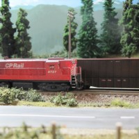 Extra 8272, the Slocan wayfreight, picking up chip hoppers at South Slocan