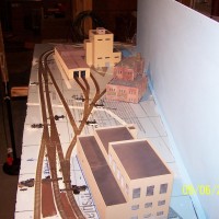 Early production of the "industry" side of the layout. The background building is the Superior Paper Kraft Mill, standing in as a coal fired power plant.