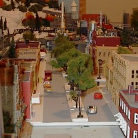 End of the city view building not complete need painting and weathering street not complete. Street lights work this layout can run 4 non DCC with out problems. three outer city and one passenger inter city limints