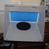 Here is the spray booth open. It came with a turntable (the round black object). There's also a flexible hose that mounts to the back to draw fumes to an open window.