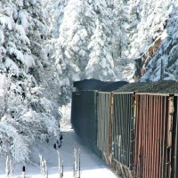 Coal loads east out of Tunnel 7 in snow