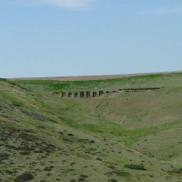 From across Red Coulee, the collapsed wood trestle seen earlier
