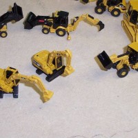 Close up of the 4 types of Caterpillar construction equipment vehicles