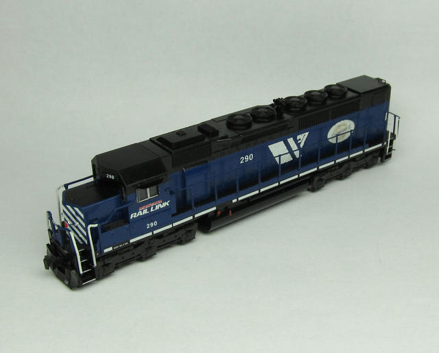 MRL 290, SDP40-2XR ( SDP40 ).  Made with Kato SD40 on SD45 sill.  The rear end was made with styrene, BLMA doors and grabs and a detail Associates headlight.  The walkway behind the cab was modified with styrene (LOTS of styrene!), BLMA tread plate and GMM brass handrails.  Other details: BLMA 5 chime on a custom bracket and BLMA sun shades and wind deflectors/ mirrors.  The engine was modeled for a 2007 time frame, the centennial logo is faded and by this time it recieved the larger white sill stripes.