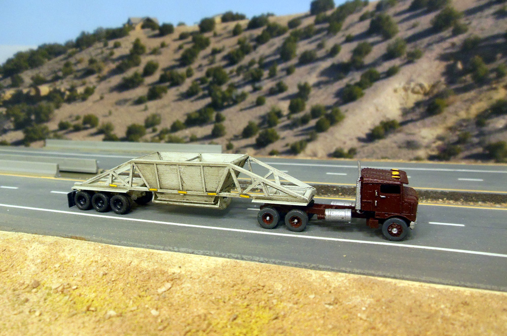 Shapeways drop bottom trailer being pulled by GHQ tractor